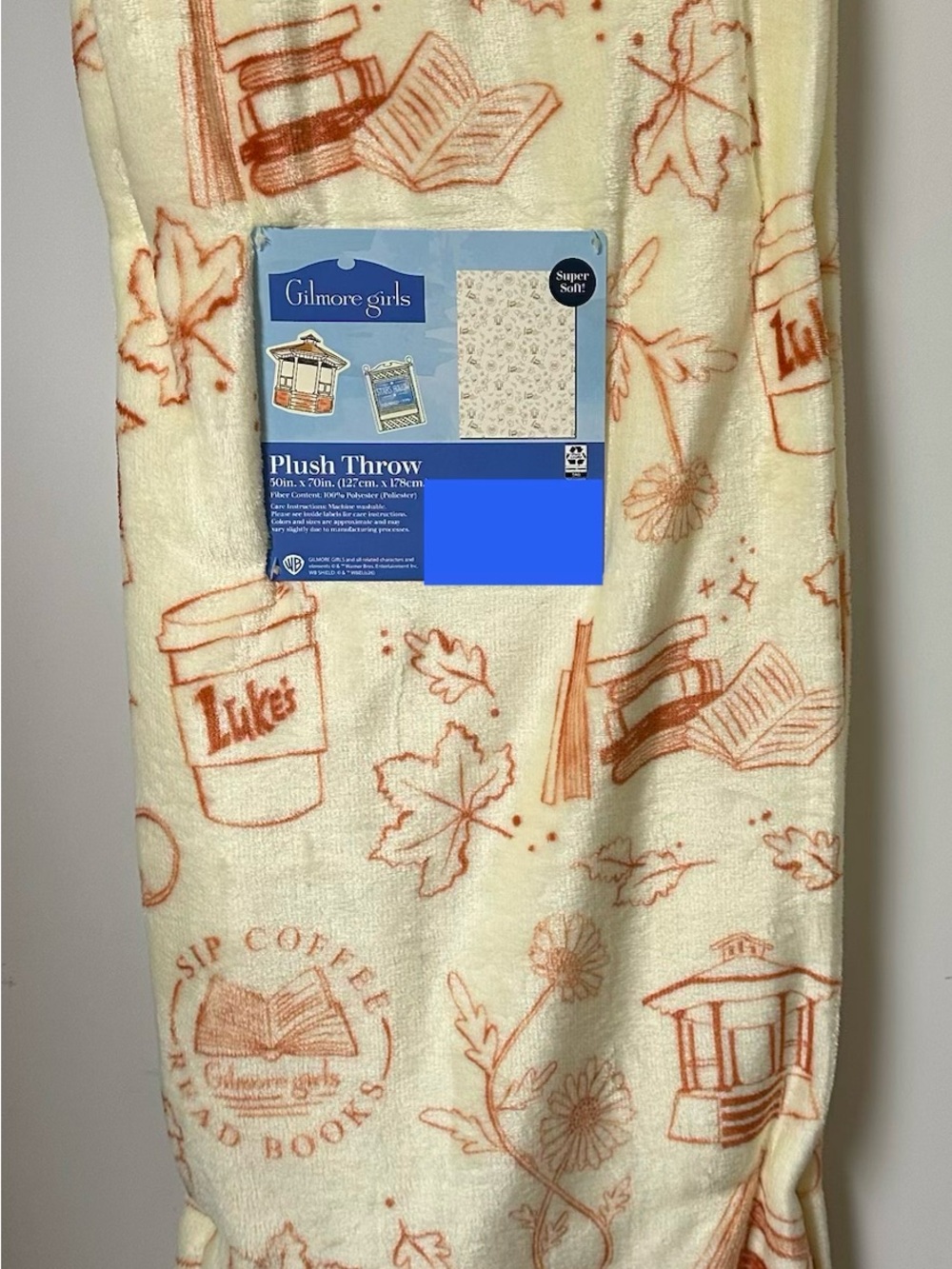 New Gilmore Girls Fall Blanket Cream and Orange Luke’s Diner Books